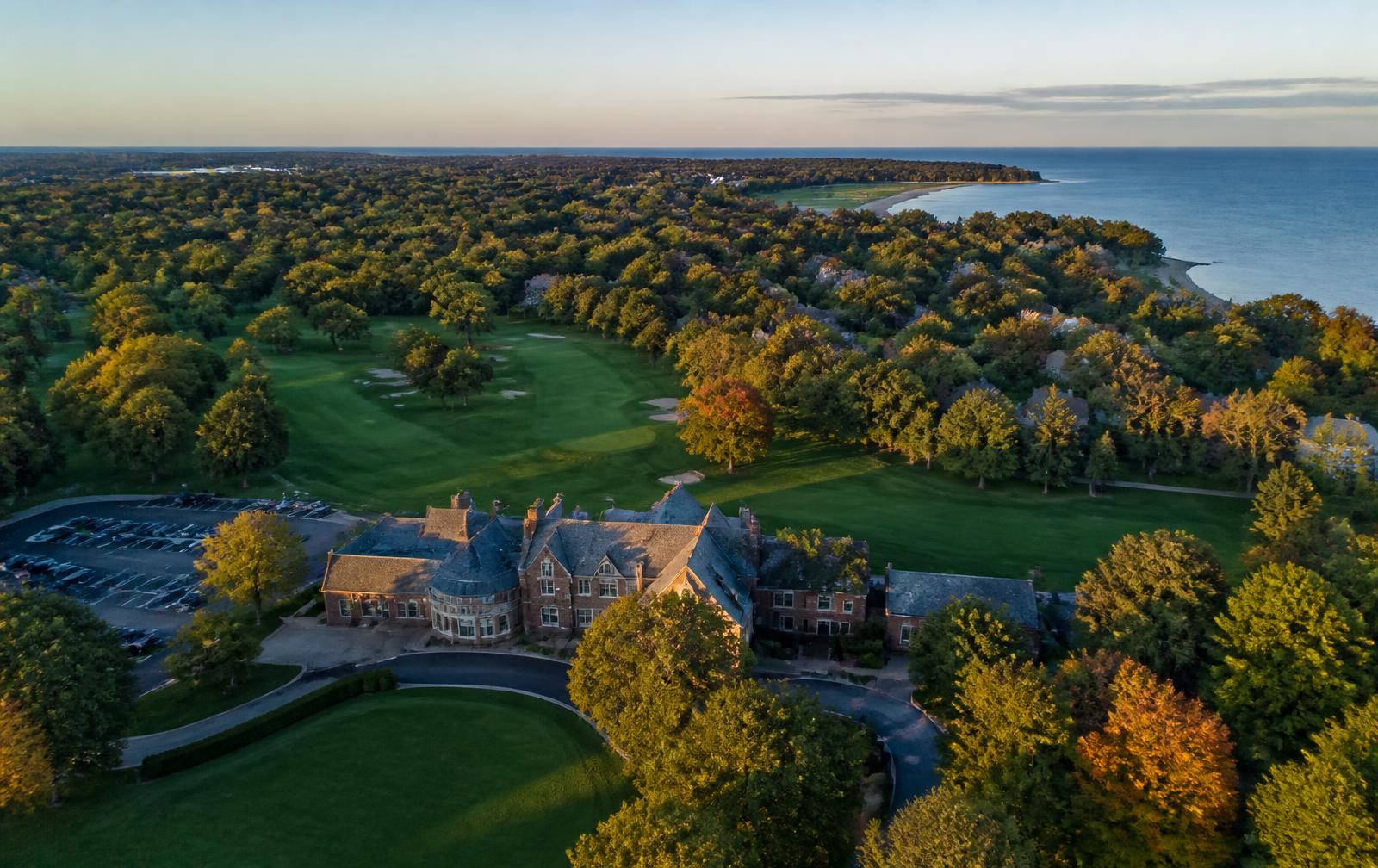 Aerial view of a historic member-owned country club on Chicago's North Shore near Lake Forest, Illinois, at golden hour.